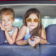 Happy kids in the car. Family on vacation. Summer holiday and car travel concept